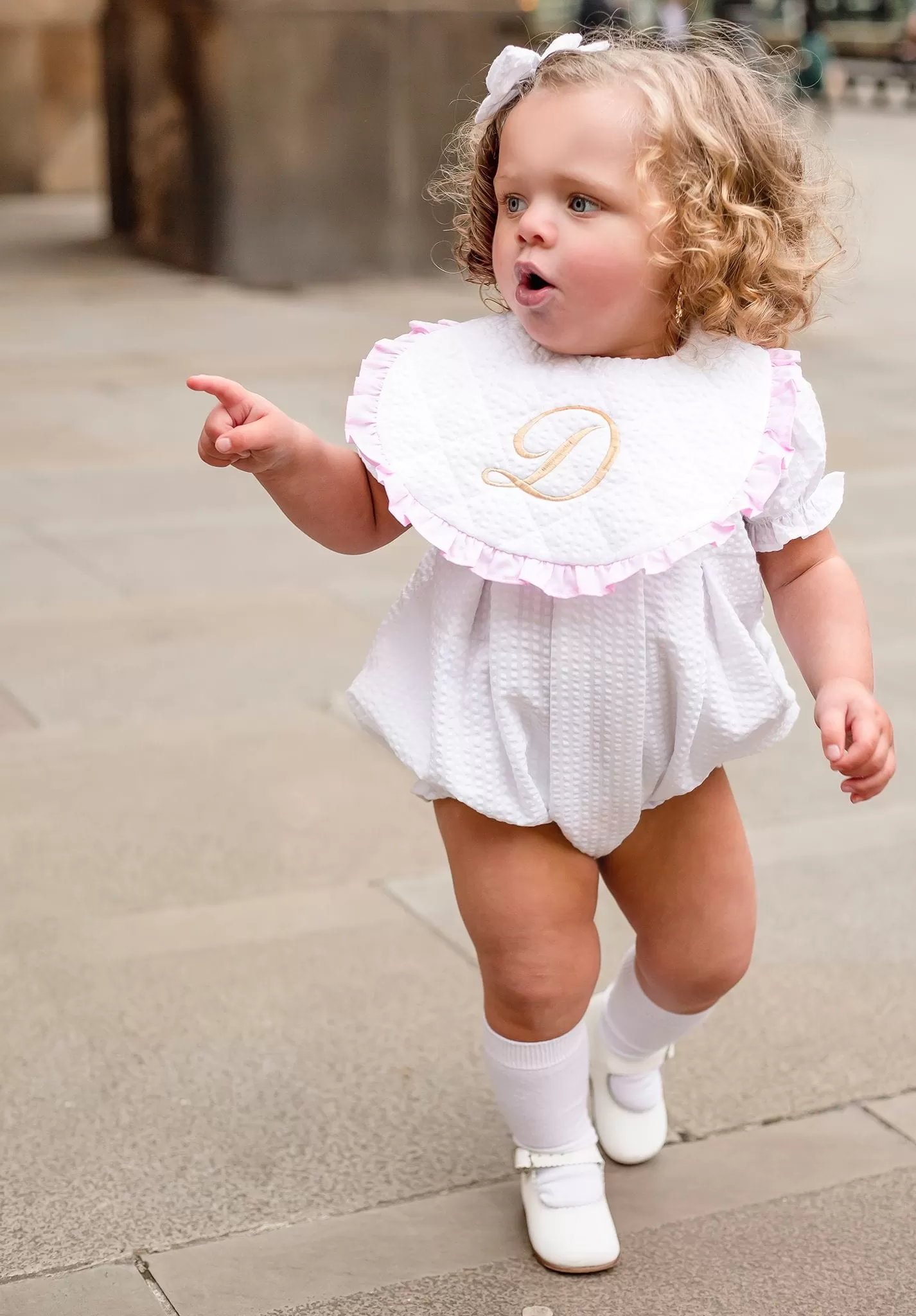 Girls Seersucker Short Sleeve Romper Trimmed With Pink