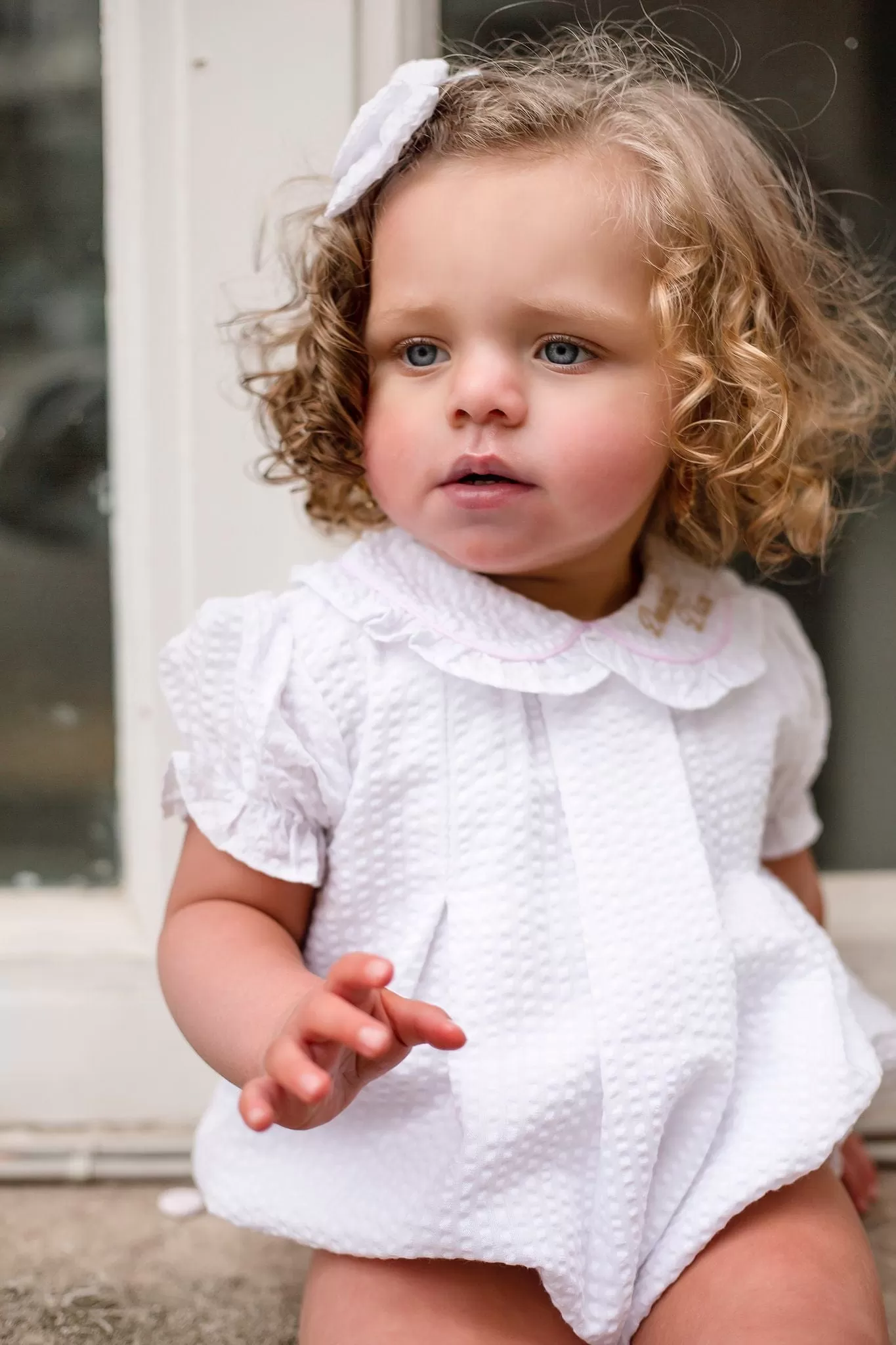 Girls Seersucker Short Sleeve Romper Trimmed With Pink