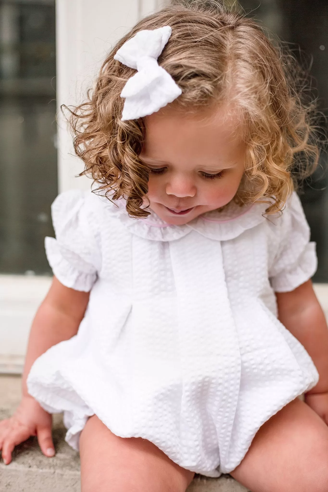 Girls Seersucker Short Sleeve Romper Trimmed With Pink